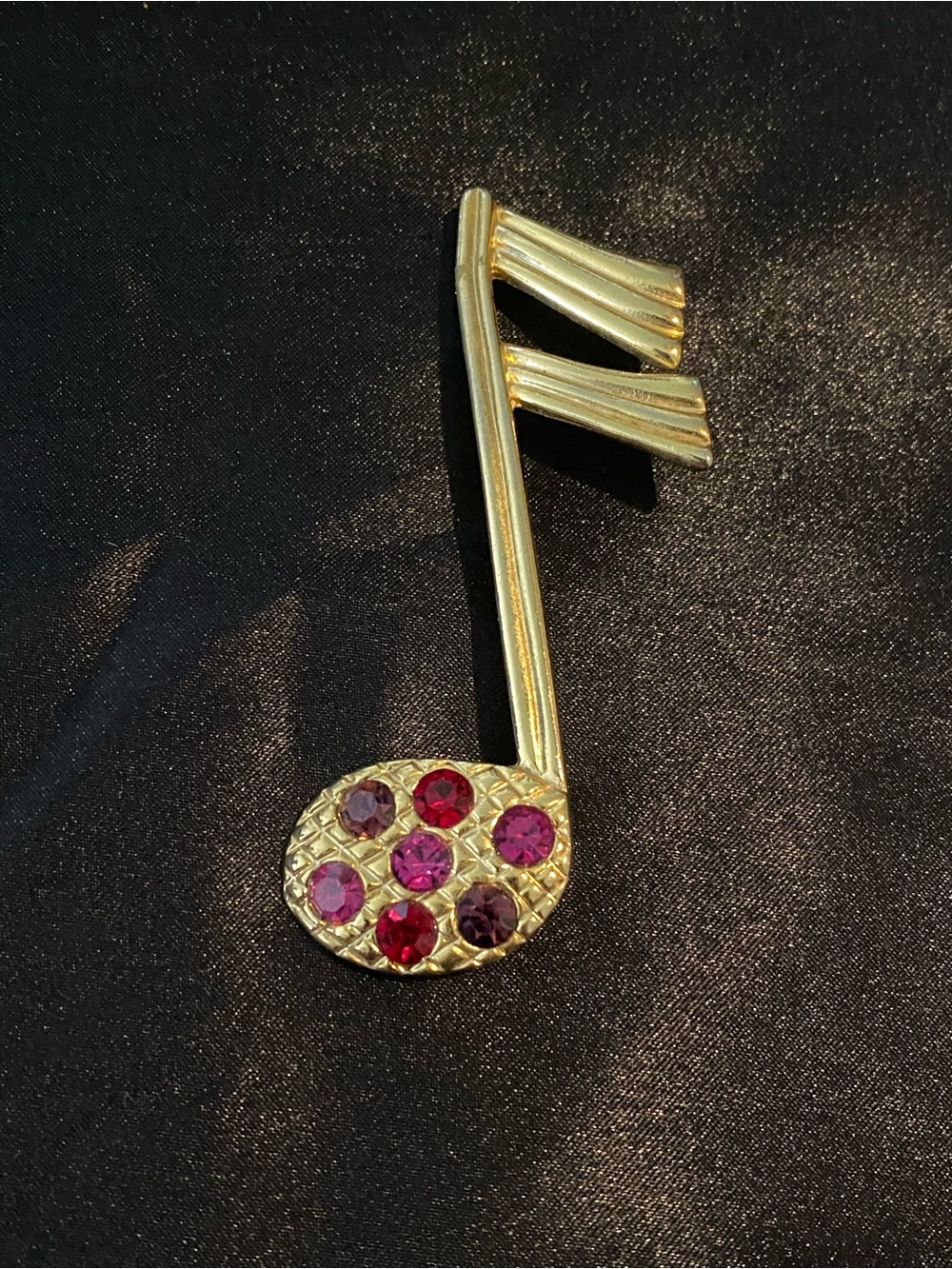 Gold-Tone Musical Note Brooch with Pink & Red Stones